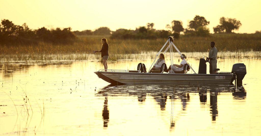 Botswana Okavango delta Xaranna fishing sunset family safari