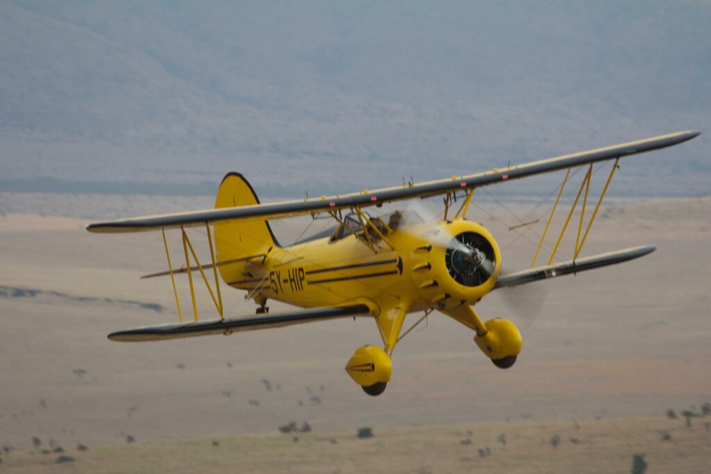 Kenya Lewa Wilderness yellow biplane